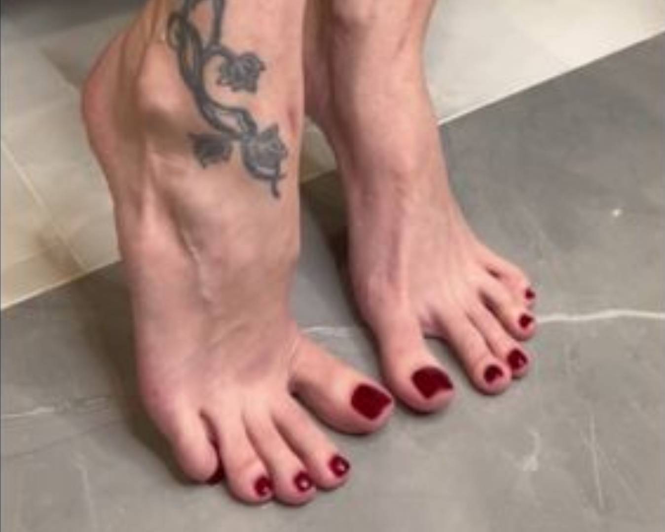 Spit on bare feet with long toes