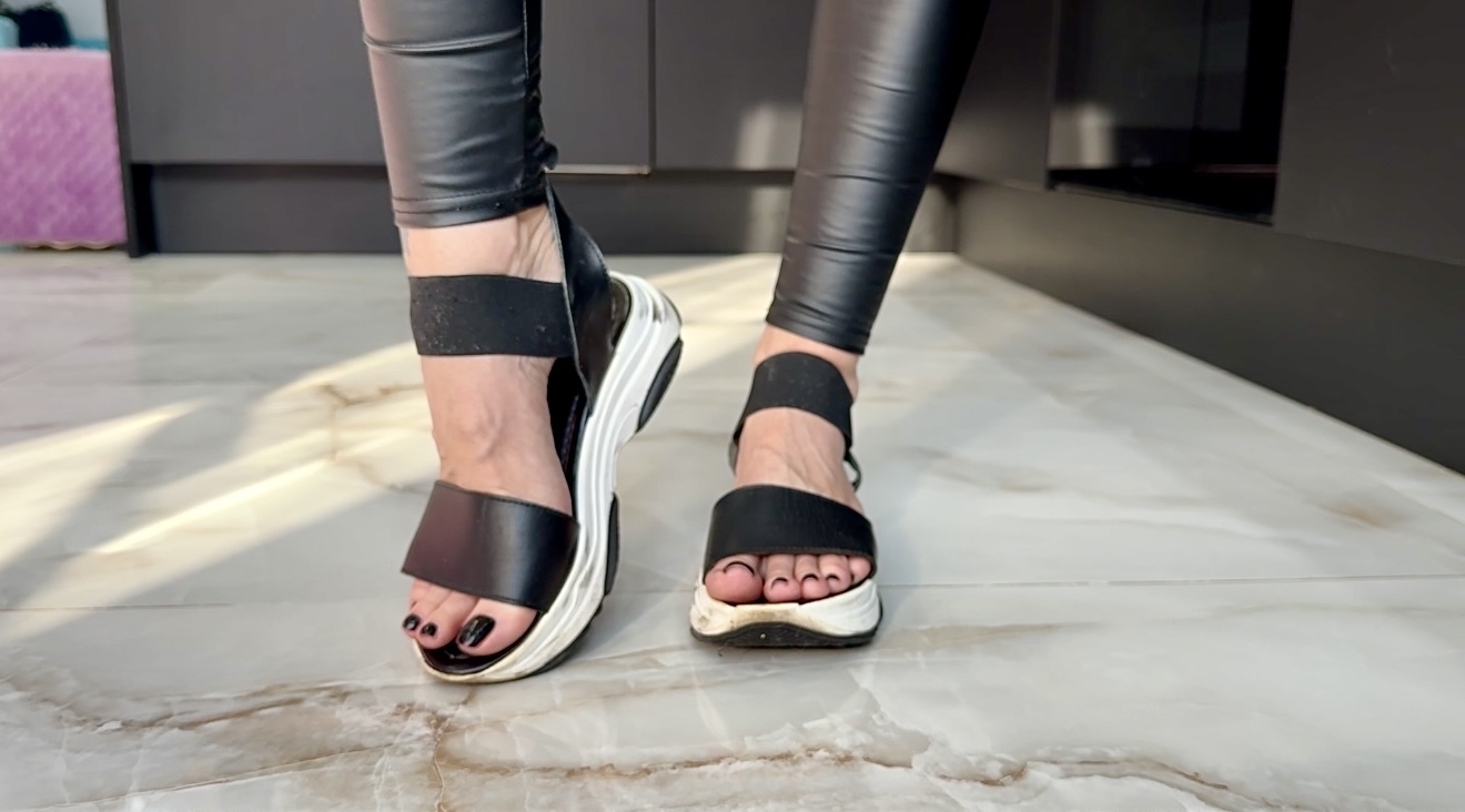 Sandals and black tight leather leggings, black toenails polish