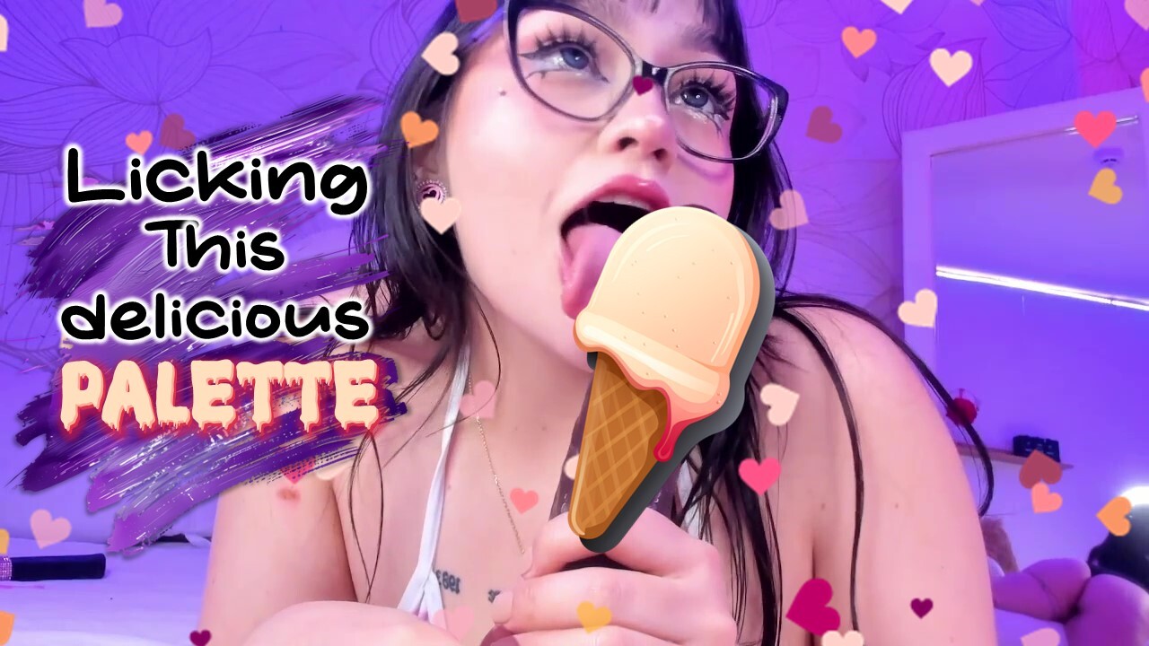 Beautiful girl licking a delicious creamy lollipop