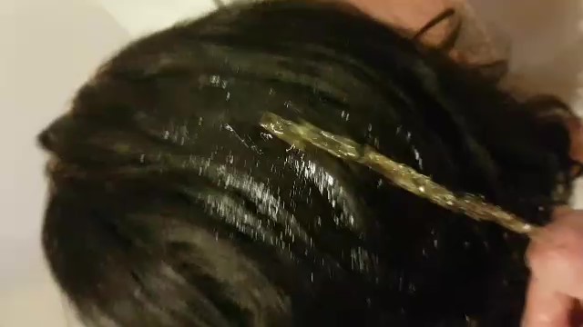 and then he ran his golden juice over her head and hair